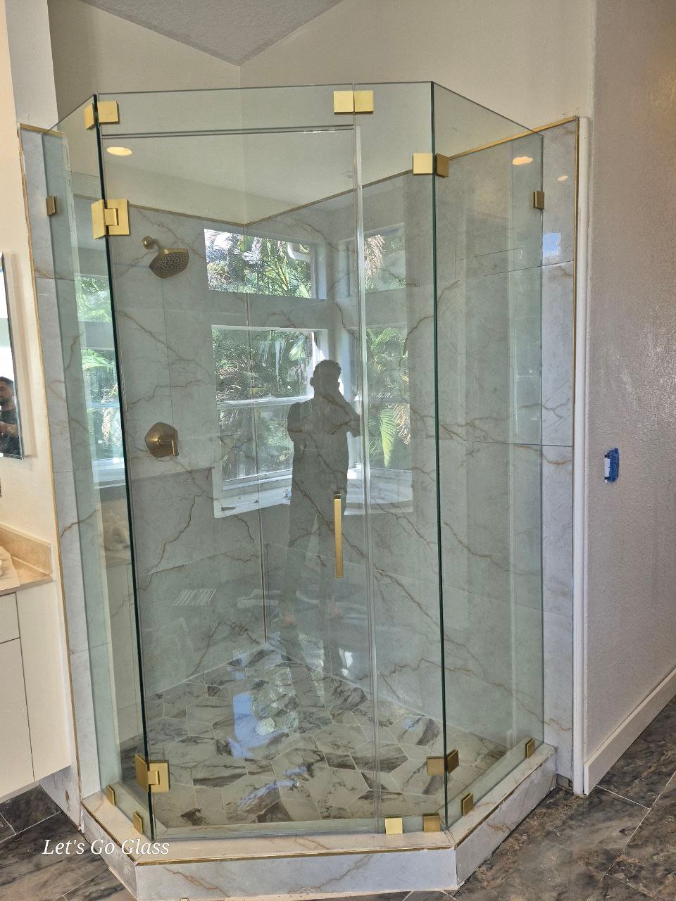 Frameless glass shower door installed by Let's Go Glass