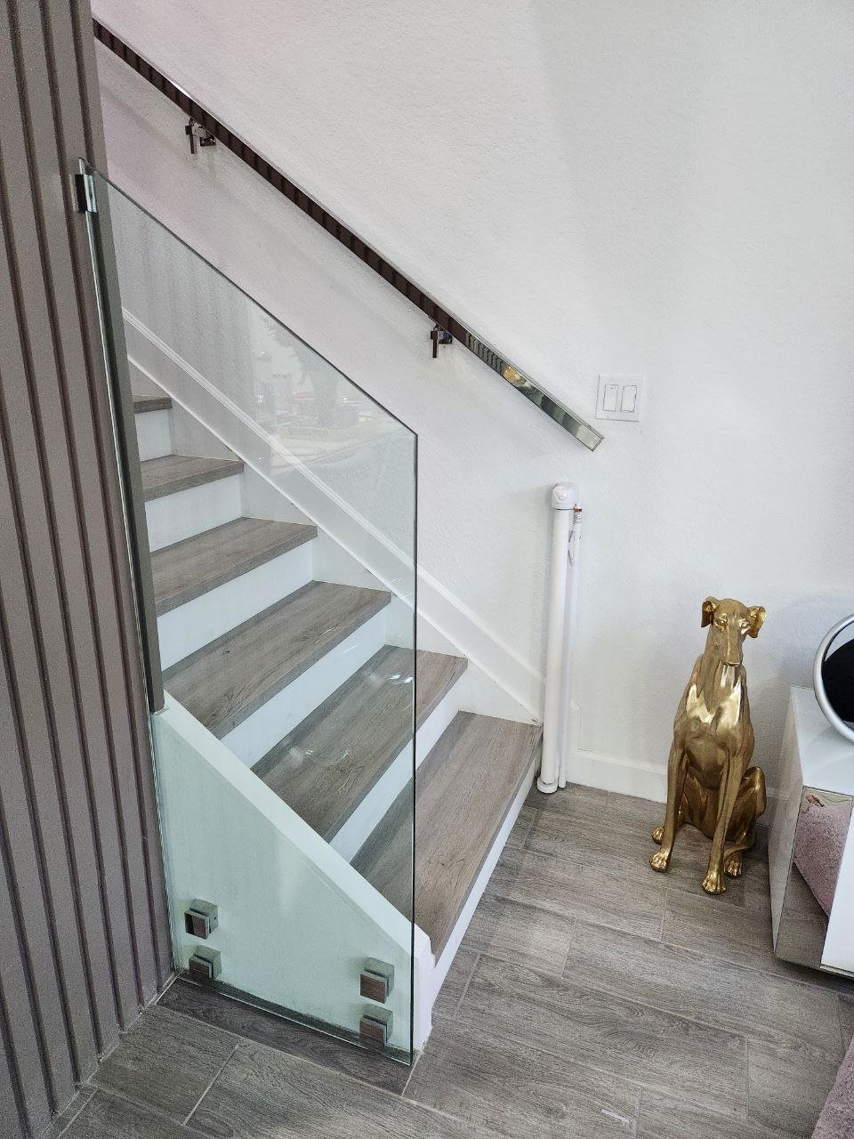 Glass stair railing installed by Let's Go Glass